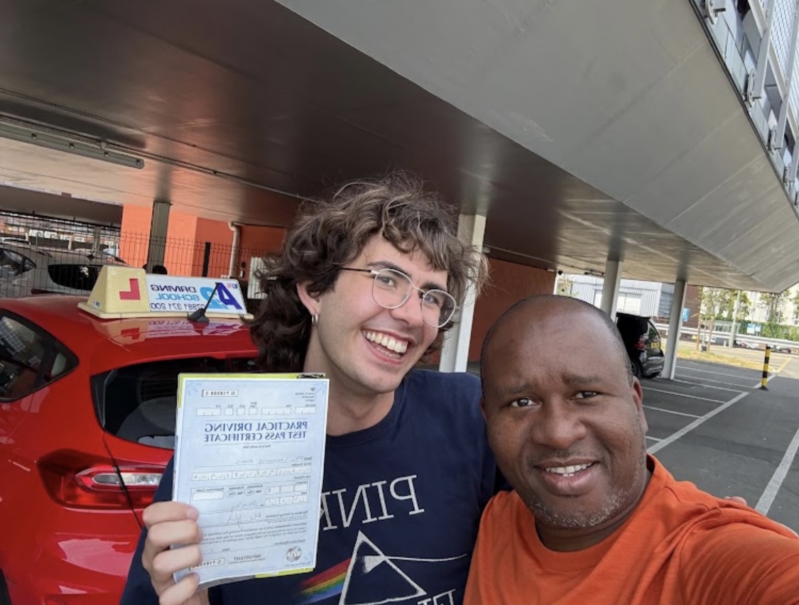 A2 Driving School instructor celebrating with a pupil who has just passed