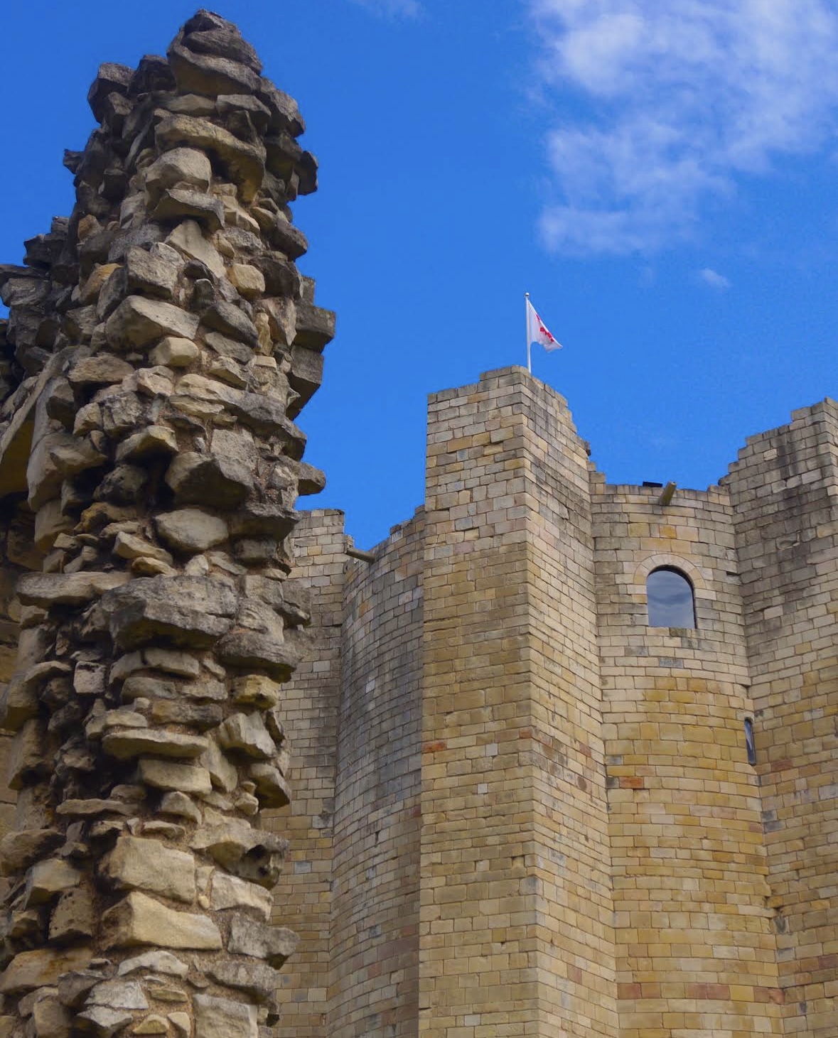 Historic stone architecture beneath a vivid blue sky